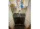 Laundry closet with side-by-side washer and dryer with shelving for storage at 8957 Stonebridge Blvd, Douglasville, GA 30134