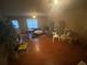 Spacious living room with laminate floors, large windows, and natural light at 8957 Stonebridge Blvd, Douglasville, GA 30134