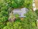 An aerial view of a home nestled among lush trees and greenery at 4444 Cannon Sw Rd, Loganville, GA 30052