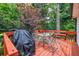 Outdoor living with the beautiful deck with a barbeque and furniture at 4444 Cannon Sw Rd, Loganville, GA 30052