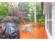 Cozy back deck with table, chairs, grill, and wooded view at 4444 Cannon Sw Rd, Loganville, GA 30052