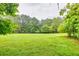 Green backyard and trees at 4444 Cannon Sw Rd, Loganville, GA 30052