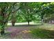 Spacious backyard bordered with metal fence at 4444 Cannon Sw Rd, Loganville, GA 30052