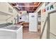 Basement laundry area offers ample storage and utility at 4444 Cannon Sw Rd, Loganville, GA 30052