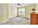 Neutral bedroom featuring a window, carpeting, and a ceiling fan for comfort at 4444 Cannon Sw Rd, Loganville, GA 30052