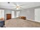 Neutral-toned bedroom featuring a ceiling fan and ample space at 4444 Cannon Sw Rd, Loganville, GA 30052