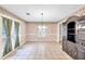 Dining room featuring tile floors, floral wallpaper, and natural light at 4444 Cannon Sw Rd, Loganville, GA 30052