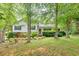 Charming single-story home featuring mature landscaping and a welcoming front porch at 4444 Cannon Sw Rd, Loganville, GA 30052