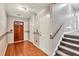Traditional foyer featuring hardwood floors, staircase, and dark wood front door at 4444 Cannon Sw Rd, Loganville, GA 30052