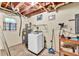 Functional laundry room with washer and utility sink at 4444 Cannon Sw Rd, Loganville, GA 30052