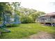 Backyard featuring mature trees, house and trampoline at 4565 Deerfield Dr, Cumming, GA 30028