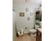 Bright bathroom features a toilet, vanity with storage, and charming decorations, perfect for modern comfort at 4565 Deerfield Dr, Cumming, GA 30028
