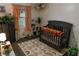 Charming Bedroom with a crib, rainbow rug, and soft decor, creating a warm and inviting space for a baby at 4565 Deerfield Dr, Cumming, GA 30028