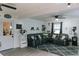 Inviting living room with a sectional couch, hardwood floors, and a decorative rug at 4565 Deerfield Dr, Cumming, GA 30028