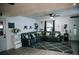 Cozy living room with a large sectional couch, hardwood floors, and ample natural light at 4565 Deerfield Dr, Cumming, GA 30028