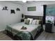 Comfortable primary bedroom featuring a king-sized bed, soft bedding, and modern decor at 4565 Deerfield Dr, Cumming, GA 30028