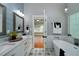 Stylish bathroom with double vanity, soaking tub and designer tile at 90 Barrington Grange Dr, Sharpsburg, GA 30277