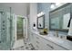 Beautiful bathroom featuring double vanity and a glass-enclosed shower at 90 Barrington Grange Dr, Sharpsburg, GA 30277