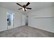 Cozy bedroom with ceiling fan, carpeted floor and bathroom access at 90 Barrington Grange Dr, Sharpsburg, GA 30277