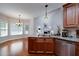 Open kitchen with island, stainless steel appliances and a breakfast area at 90 Barrington Grange Dr, Sharpsburg, GA 30277