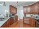 Kitchen with granite countertops, stainless steel appliances, and hardwood floors at 90 Barrington Grange Dr, Sharpsburg, GA 30277