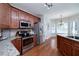 Modern kitchen with stainless steel appliances and granite countertops at 90 Barrington Grange Dr, Sharpsburg, GA 30277