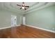 Large bedroom with hardwood floors and ensuite bathroom access at 90 Barrington Grange Dr, Sharpsburg, GA 30277
