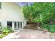 Outdoor patio with brick pavers and stairs to an upper garden area at 90 Barrington Grange Dr, Sharpsburg, GA 30277