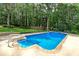 Refreshing pool surrounded by lush greenery and a well-manicured lawn, creating a serene outdoor escape at 90 Barrington Grange Dr, Sharpsburg, GA 30277
