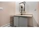 Bathroom featuring vanity with sink and storage in a compact space with neutral walls at 140 Indian Lake Dr, Hiram, GA 30141