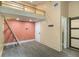 View of bedroom featuring built-in loft with ladder and modern gray flooring at 140 Indian Lake Dr, Hiram, GA 30141