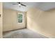 Bright bedroom featuring a window with a view of the trees at 140 Indian Lake Dr, Hiram, GA 30141