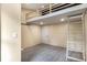 View of bedroom featuring built-in loft with ladder and modern gray flooring at 140 Indian Lake Dr, Hiram, GA 30141