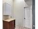 This laundry room features a cabinet and a wood-surface folding counter at 140 Indian Lake Dr, Hiram, GA 30141
