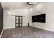 Spacious living room featuring modern ceiling fan and chalkboard wall at 140 Indian Lake Dr, Hiram, GA 30141