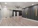 The expansive living room features vinyl flooring, recessed lighting, and unique accent walls at 140 Indian Lake Dr, Hiram, GA 30141