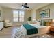 A spacious and bright bedroom featuring stylish decor, a large window, and a ceiling fan at 1456 S Gordon Sw St, Atlanta, GA 30310
