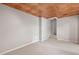 A finished basement area with carpet, stairs and a beautifully decorated ceiling at 4016 Upland Trce, Marietta, GA 30066