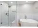 Bathroom featuring a glass shower and soaking tub at 4016 Upland Trce, Marietta, GA 30066