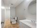 A half bathroom features tile floor, toilet, vanity, and round mirror at 4016 Upland Trce, Marietta, GA 30066