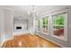 Dining room area featuring hardwood floors, built-in shelving and cabinets, and large windows at 4016 Upland Trce, Marietta, GA 30066