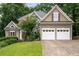 Charming two-story home with mature trees, a well-manicured lawn and two-car garage at 4016 Upland Trce, Marietta, GA 30066