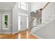 Bright foyer with hardwood floors, staircase, and high ceilings showcasing natural light at 4016 Upland Trce, Marietta, GA 30066