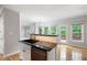 Kitchen featuring granite countertops and stainless appliances open to a living area at 4016 Upland Trce, Marietta, GA 30066