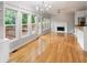 Spacious living space featuring hardwood floors, fireplace, deck access, and access to the kitchen at 4016 Upland Trce, Marietta, GA 30066