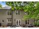 Beautiful backyard with a patio, seating, and lush greenery, perfect for outdoor living and relaxation at 4401 Madison Woods Nw Dr, Marietta, GA 30064