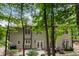 Spacious backyard with a patio, mature trees, and manicured landscaping providing a serene outdoor space at 4401 Madison Woods Nw Dr, Marietta, GA 30064