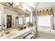 Elegant bathroom features a double vanity, soaking tub, and separate glass shower at 4401 Madison Woods Nw Dr, Marietta, GA 30064