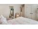 Cozy bedroom with a full-length mirror, neutral walls, white trim, and a comfortable bed at 4401 Madison Woods Nw Dr, Marietta, GA 30064