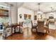 Charming dining nook with elegant chairs, natural light, and hardwood floors at 4401 Madison Woods Nw Dr, Marietta, GA 30064